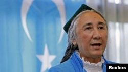 Uighur leader Rebiya Kadeer delivers a speech in front of a East Turkestan flag at the fourth General Assembly of the World Uighur Congress in Tokyo, May 14, 2012.