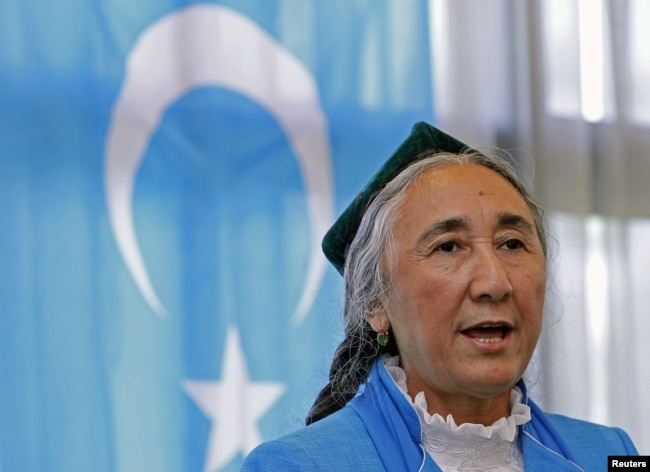 FILE - Uyghur leader Rebiya Kadeer delivers a speech in front of an East Turkestan flag at the fourth General Assembly of the World Uyghur Congress in Tokyo, May 14, 2012.