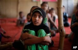 Children of Rohingya refugees attend a temporary school run by a non-governmental organization at a camp for Rohingyas in New Delhi, India, Aug. 16, 2017.