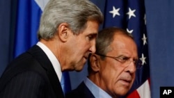 U.S. Secretary of State John Kerry and Russian Foreign Minister Sergey Lavrov, right, arrive for their press conference before their meeting to discuss the ongoing crisis in Syria, in Geneva, Sept. 12, 2013.