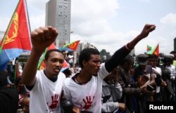 FILE - Eritrean refugees chant slogans as they participate in a demonstration in support of a U.N. human rights report accusing Eritrean leaders of crimes against humanity in front of the Africa Union headquarters in Ethiopia's capital Addis Ababa, June 2016.