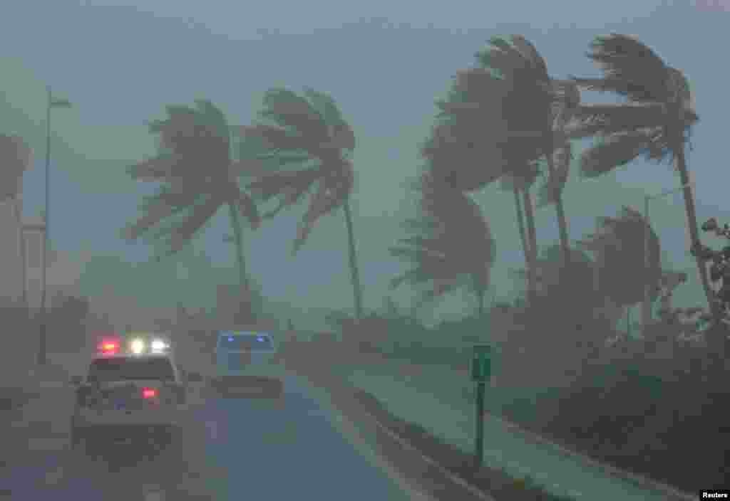Police patrol the area as Hurricane Irma slams across islands in the northern Caribbean on in San Juan, Puerto Rico.