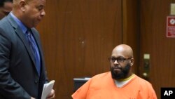 FILE - Marion "Suge" Knight, right, appears with his attorney Matthew Fletcher, left, in court for a hearing about evidence in his murder case in Los Angeles, Calif., March 9, 2015.