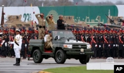 FILE - A military parade is held to mark Pakistan National Day, in Islamabad, Pakistan, March 23, 2019.