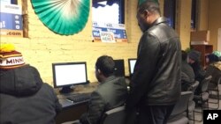 People use computers at an employment center in the heart of Minneapolis' largest Somali neighborhood, Dec. 20, 2016.
