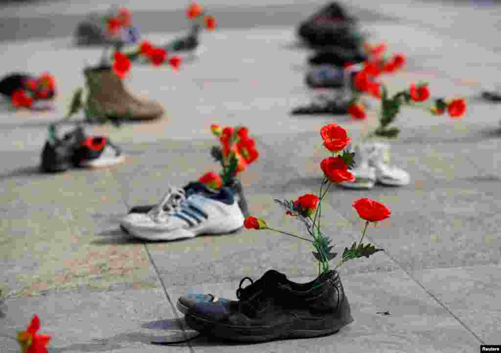 Shoes with flowers are pictured during a demonstration against the speech of Seyyed Ali Reza Avai, Minister of Justice of Iran, at the Human Rights Council, in front of the United Nations in Geneva, Switzerland, Feb. 27, 2018.