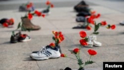 Shoes with flowers are a demonstration against the speech of Seyyed Ali Reza Avai, Minister of Justice of Iran, at the Human Rights Council in Geneva, Switzerland. (File)