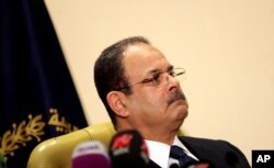 FILE -- Egyptian Interior Minister Magdy Abdel-Ghaffar appears live on state and private television, in Cairo, Egypt, March 6, 2016. Abdel-Ghaffar warned of a “conspiratorial scheme” by the now-banned Muslim Brotherhood to incite chaos, in comments published in state-owned newspapers.