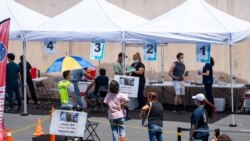 People line up for COVID-19 vaccines at Kheir Center, in the Koreatown neighborhood of Los Angeles.CA.