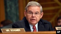 FILE - Sen. Robert Menendez, D-N.J. addresses fellow members of the Senate Banking Committee in Washington, Jan. 27, 2015.