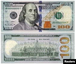FILE - A combination photo shows the front and back of the newly designed $100 bill.