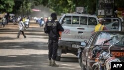 FILE - A Cameroonian policeman patrols in Maroua, in the extreme northern province, west of the Nigerian border.