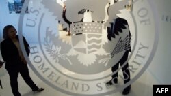 FILE - A fragment of the Department of Homeland Security's logo is seen at one of its annex facilities in Fairfax, Virginia, July 22, 2015.