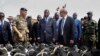 FILE - French Defense Minister Jean-Yves Le Drian (C) flanked by President of the Central African Republic Faustin-Archange Touadera (2ndL), looks at military supplies at the Mpoko military base in Bangui, Oct. 31, 2016.