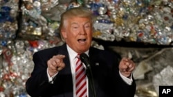 FILE - Then-presidential candidate Donald Trump speaks during a campaign stop at Alumisource, a metals recycling facility in Monessen, Pa., June 28, 2016. Trump has broken with decades of conservative economic thinking on the value of free trade.