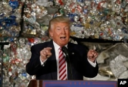 FILE - Then-presidential candidate Donald Trump speaks during a campaign stop at Alumisource, a metals recycling facility in Monessen, Pennsylvania, June 28, 2016. Trump has broken with decades of conservative economic thinking on the value of free trade.