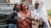 Relatives and friends grieve during the funeral of Patrick Ndikumana, Friday, July 3, 2015, in Bujumbura, Burundi. According to relatives Ndikumana was killed in the police attack in Jabe neighborhood last week. A U.N. observer mission concluded Thursday that this week's parliamentary elections in Burundi were not "free, credible and inclusive." ((AP Photo/Bertheir Mugiraneza)