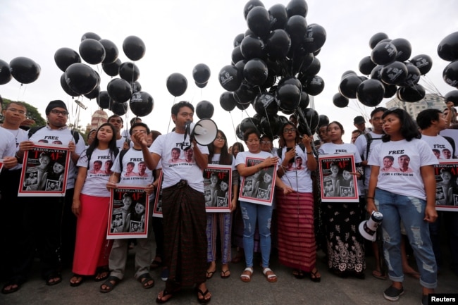 Activists gather at a rally, calling for the release of imprisoned Reuters journalists Wa Lone and Kyaw Soe Oo, one year after they were arrested, in Yangon, Myanmar, Dec.12, 2018.