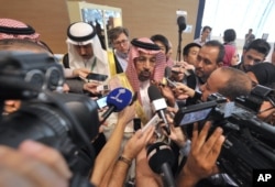 FILE - Khalid al-Falih, Minister of Energy, Industry and Mineral Resources of Saudi Arabia, answers questions as part of the 15th International Energy Forum Ministerial meeting in Algiers, Algeria, Sept. 27, 2016.