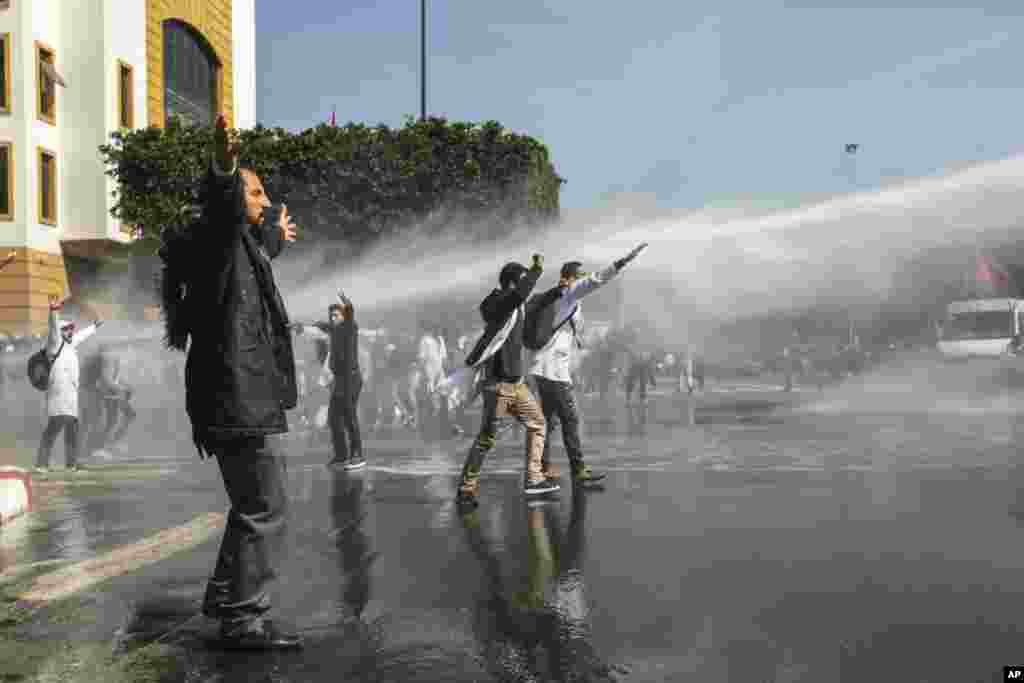 Security forces use water cannons to disperse protesting teachers in Rabat, Morocco.