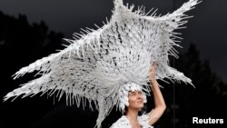 Larisa Katz attends the Royal Ascot horse races wearing a hat she made -- out of recycled plastic spoons! Hats off to her! (Reuters / Toby MelvilleLivepic)