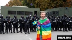 A participant attends the Equality March, organized by the LGBT+ community in Kyiv, Ukraine, Sept. 19, 2021. 