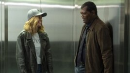 This image released by Disney-Marvel shows Samuel L. Jackson, right, with Brie Larson on the set of 