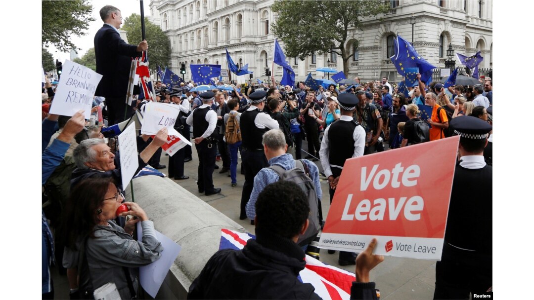 FILE - Brexit supporters form a counter demonstration as Pro-Europe demonstrators protest during a "March for Europe" against the Brexit vote result earlier in the year, in London, Britain, Sept. 3, 2016.