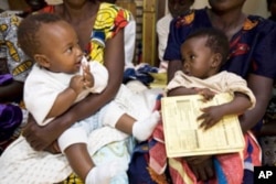 Rwandan children receiving pneumococcal vaccine, April 2009