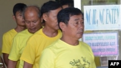 A group of Chinese fishermen leave a court in Puerto Princesa, Palawan island, Nov. 24, 2014, after they were found guilty of poaching. 
