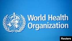 资料照片：2020年2月2日，世界卫生组织在瑞士日内瓦总部大楼上的标识。（路透社照片）