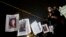 People hug next to images of murdered women following a Day of the Dead march calling for justice for victims of femicide, in Mexico City, Nov. 1, 2017. Many mothers of women who were murdered led the march wearing traditional "Catrina" face paint and carrying pictures of women who have been killed. 