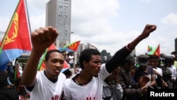 FILE - Eritrean refugees chant slogans as they participate in a demonstration in support of a U.N. human rights report accusing Eritrean leaders of crimes against humanity in front of the Africa Union headquarters in Ethiopia's capital, June 23, 2016.