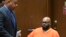 FILE - Marion "Suge" Knight, right, appears with his attorney Matthew Fletcher, left, in court for a hearing about evidence in his murder case in Los Angeles, Calif., March 9, 2015.