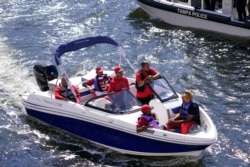 FILE - In this Feb. 5, 2021, file photo, Tampa Bay Buccaneers fans travel by boat along the Hillsborough River in Tampa, Fla.