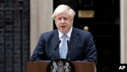 Britain's Prime Minister Boris Johnson speaks to the media outside 10 Downing Street in London, Sept. 2, 2019. Johnson says chances of a Brexit deal are rising .
