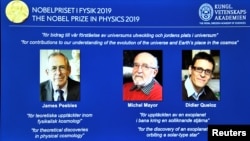 A screen displays the portraits of the laureates of the 2019 Nobel Prize in Physics (L-R) James Peebles, Michel Mayor and Didier Queloz, during a news conference at the Royal Swedish Academy of Sciences in Stockholm, Sweden, October 8, 2019. 