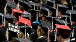 FILE - Students participate in graduation ceremonies at the University of Alabama, in Tuscaloosa, Alabama, Aug. 6, 2011.