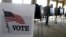 FILE - Voters cast their ballots in Hinsdale, Ill., March 18, 2014.