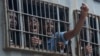 Protesters are detained by police officers following a planned demonstration to remember the victims of the historic protests against police brutality which took place four years ago, at Lekki Toll Plaza, in Lagos, Nigeria, Oct. 20, 2024.