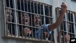 Protesters are detained by police officers following a planned demonstration to remember the victims of the historic protests against police brutality which took place four years ago, at Lekki Toll Plaza, in Lagos, Nigeria, Oct. 20, 2024.