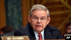 FILE - Sen. Robert Menendez addresses fellow members of the Senate Banking Committee in Washington, Jan. 27, 2015.