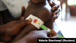 The arm measurement of a child is marked red, meaning severe malnourishment, at St. Luke Hospital in Port-au-Prince, Haiti (January 29, 2020).