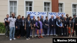 Members of the EU observer mission team pose for a group photo before their deployment Thursday in Blantyre.