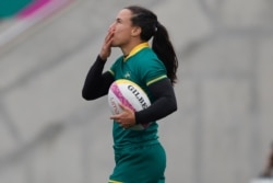 FILE - Brazil's Isadora Cerullo celebrates after scoring a try against Colombia during the women's rugby seven match for the bronze medal at the Pan American Games in Lima, Peru, July 28, 2019.
