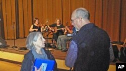 Dyann and Rick Arthur record a performance at the Portland Old-Time Music Gathering.