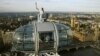 Torch bearer Amelia Hempleman-Adams, 17, stands on top of a capsule on the London Eye as part of the torch relay ahead of the London 2012 Olympic Games in London July 22, 2012. 