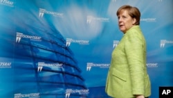 Kanselir Jerman Angela Merkel menghadiri resepsi Dewan Ekonomi Partai Demokratik Kristen Jerman di Berlin, Jerman, 27 Juni 2017. (AP Photo/Michael Sohn)