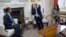 British Prime Minister David Cameron, center, meets with Former Maldives President Mohamed Nasheed and British lawyer Amal Clooney inside 10 Downing Street in London, Jan. 23, 2016.