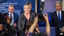 French National Front's Marine Le Pen, center, with Dutch Freedom Party leader Geert Wilders, right, and Austria Freedom Party's Harald Vilimsky gather May 28 after the European elections.